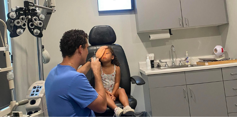 Kid having eye exam by Dr. Jason Kvitle