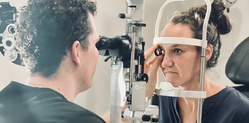 Dr Kvitle is carrying out an eye exam in the office