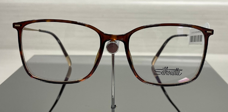 A pair of brown, rectangular Silhouette eyewear eyeglasses.]