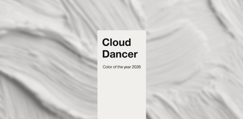 A white, textured paint background with a label in the middle containing the text ‘Cloud Dancer Color of the year 2026.